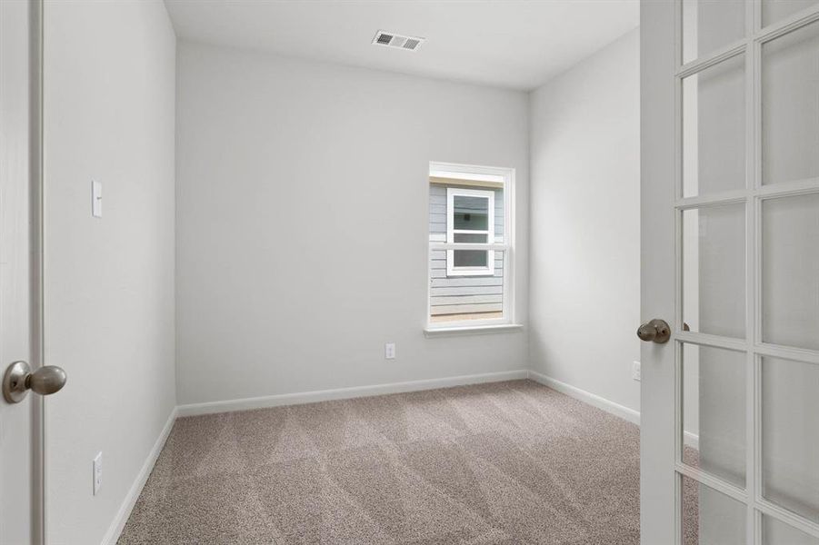 Spare room featuring light carpet Spare room featuring light carpet