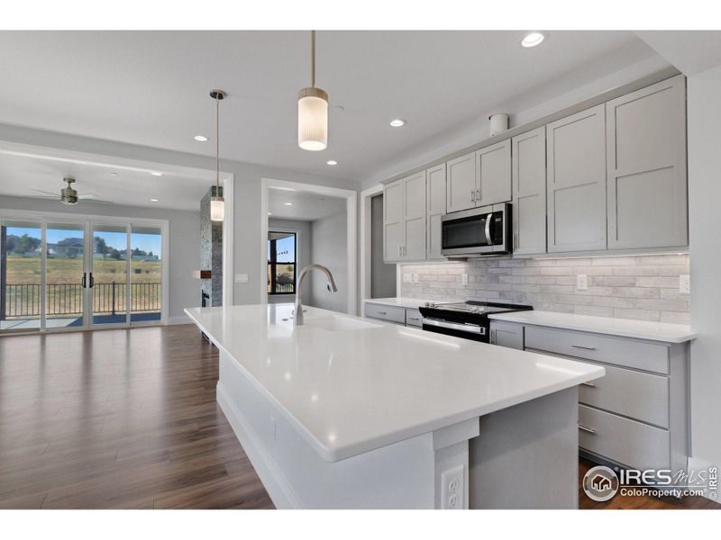 Quartz (granite is available) countertops in the kitchen and all baths