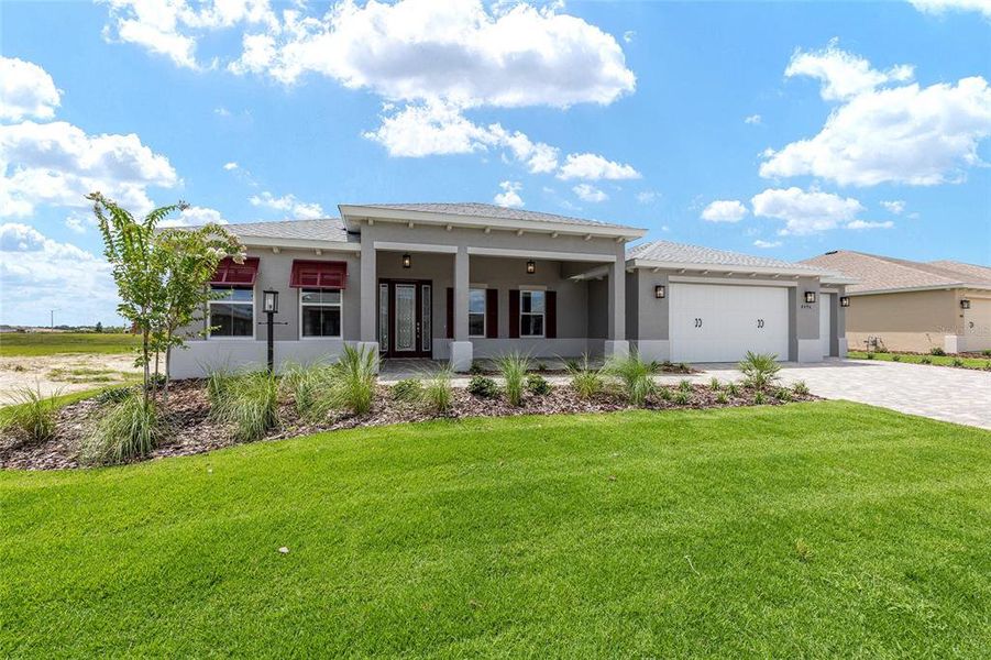 Front exterior of a new home in On Top of the World Communities, Ocala, FL, highlighting curb appeal (Image 19).