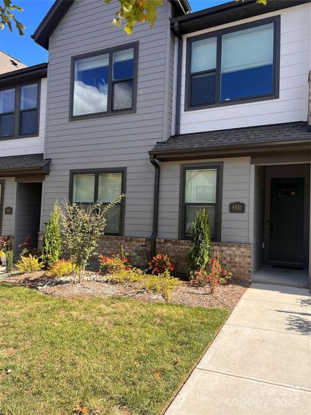 Front exterior of a new home in , Charlotte, NC, highlighting curb appeal (Image 1).
