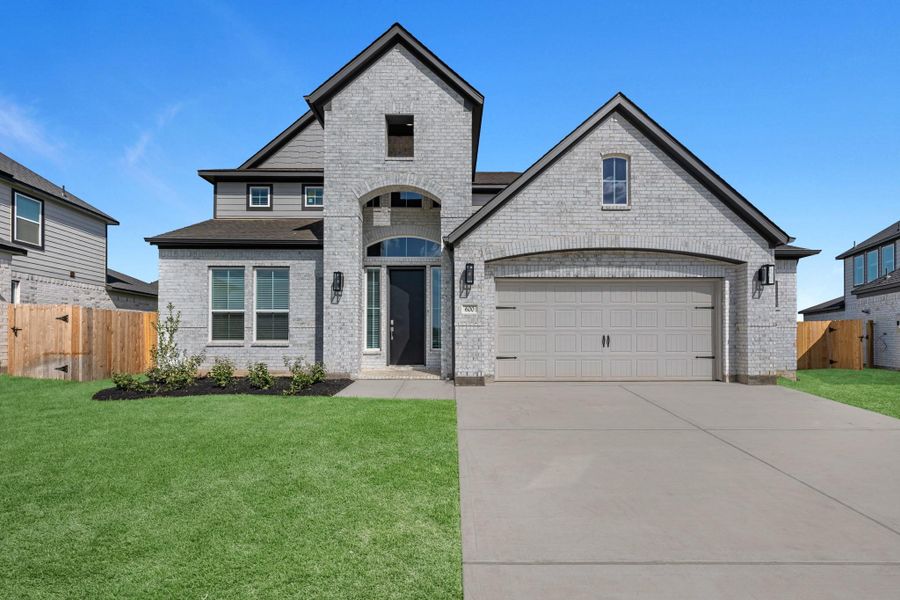 Front exterior of a new home in Beacon Hill, Waller, TX, highlighting curb appeal (Image 2). Front exterior of a new home in Beacon Hill, Waller, TX, highlighting curb appeal (Image 2).