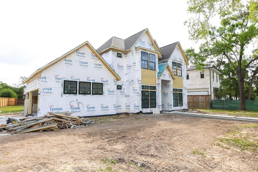Home offers a 3-car garage on side of the home. Front entry will have a grand bricked entrance w/ designer landscaping. *Construction Progress Photo taken 3/25/26*
