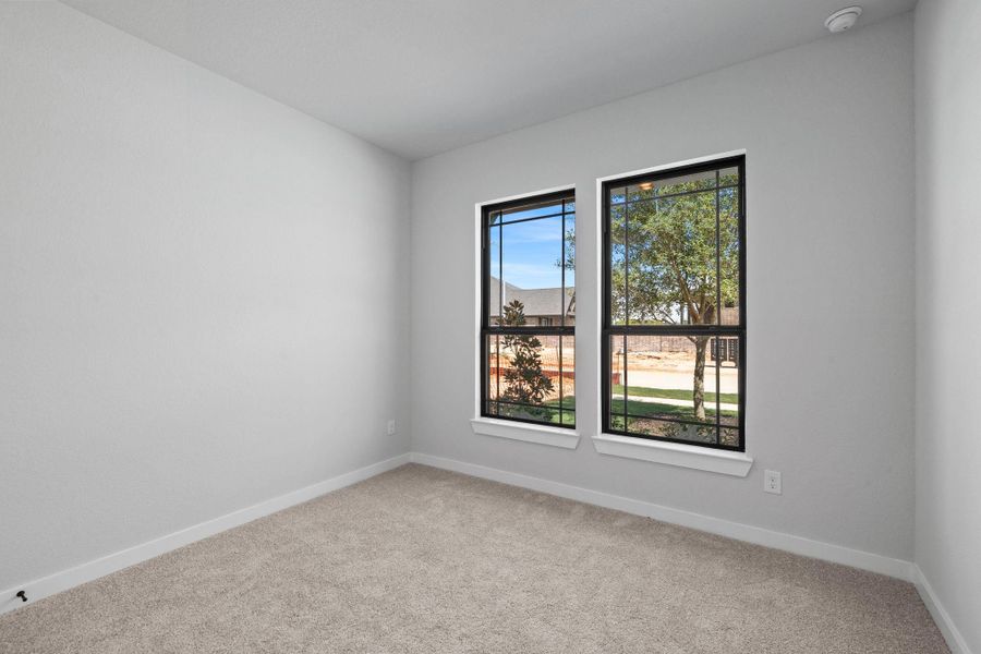 Comfortably sized guest bedroom on the first floor. Comfortably sized guest bedroom on the first floor.