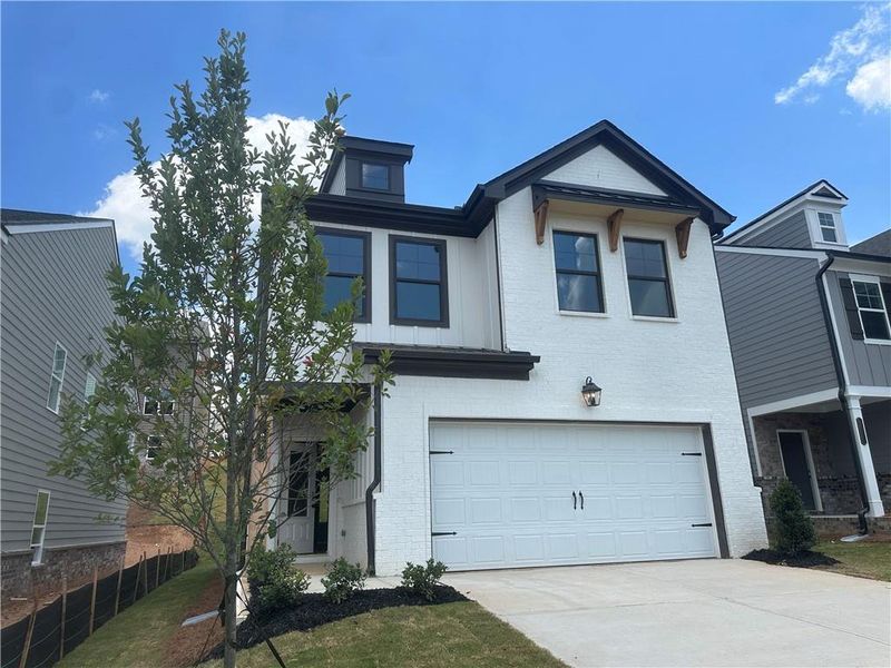 Front exterior of a new home in Kentmere, Auburn, GA, highlighting curb appeal (Image 19).