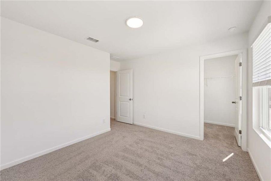 Spacious, unfurnished interior of a new home in Eastlyn Crossing, Flowery Branch (Image 22).