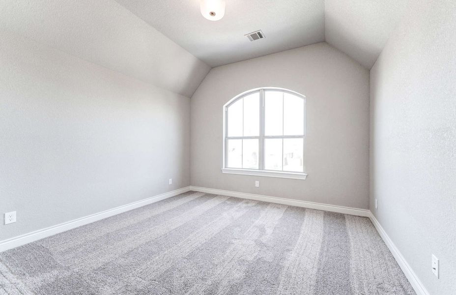Representative unfurnished interior of a home built from the 4590 by Ravenna Homes in Artavia 70′, Conroe (Image 32).