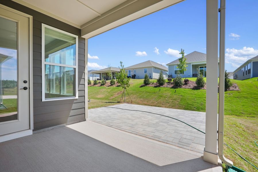 Exterior details and patio area of a home in Carolina Riverside, Belmont (Image 28).