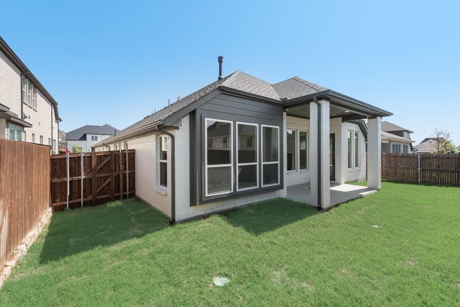 Exterior details and patio area of a home in Tavolo Park, Fort Worth (Image 3).