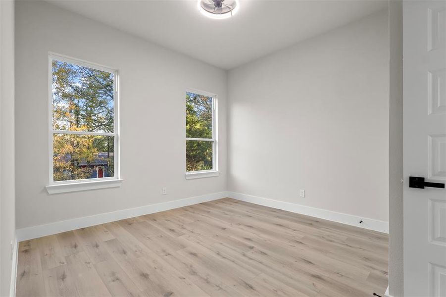 Empty room featuring light hardwood / wood-style flooring