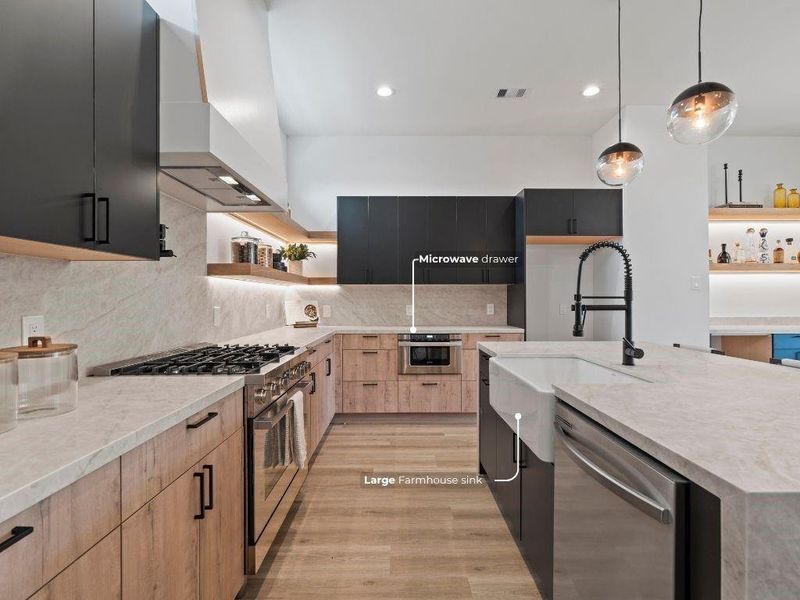 The Taj Mahal quartz continues up the backsplash, giving the kitchen an elevated, seamless look while making cleanup a breeze.