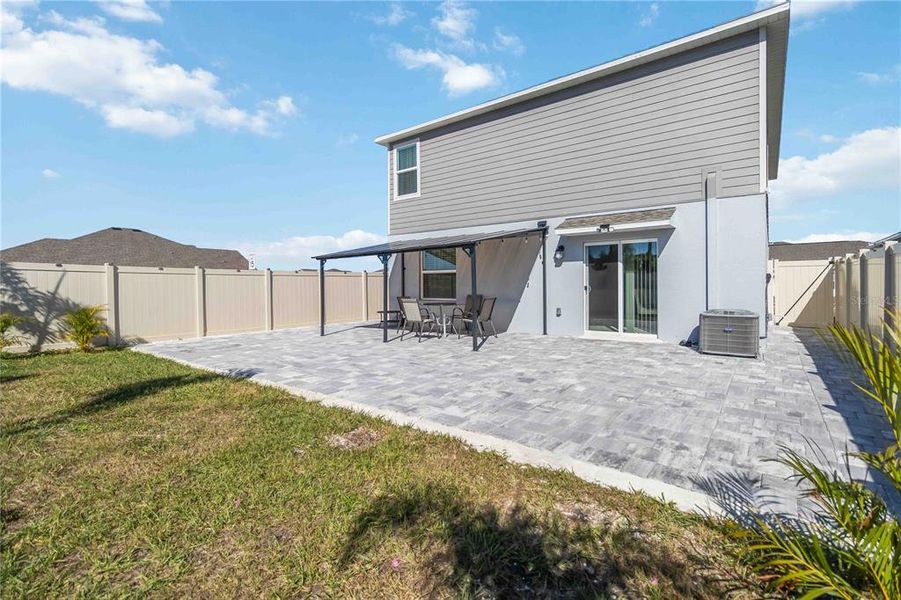 Exterior details and patio area of a home in Peace Creek Reserve: Manor Key Collection, Winter Haven (Image 4).