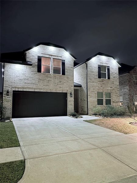 Front exterior of a new home in , Cypress, TX, highlighting curb appeal (Image 2).