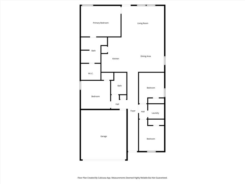 This floor plan features a spacious layout with a primary bedroom and en-suite bath, two additional bedrooms, and another bath. It includes a large living room, dining area, kitchen, laundry room, and a garage. Ideal for comfortable family living.