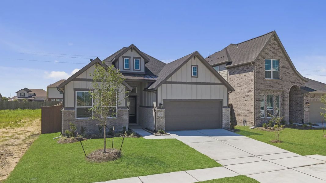 Front exterior of a new home in Blue Heron, Mont Belvieu, TX, highlighting curb appeal (Image 20). Front exterior of a new home in Blue Heron, Mont Belvieu, TX, highlighting curb appeal (Image 20).