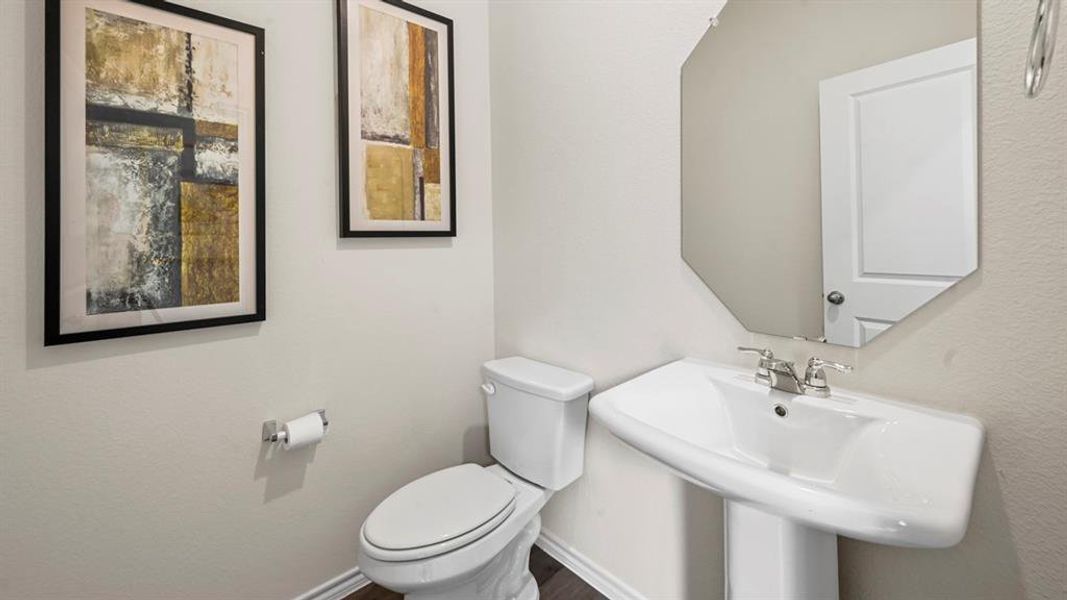 Bathroom featuring toilet and baseboards