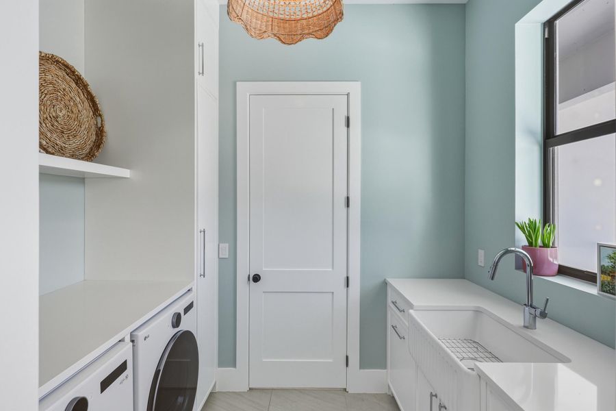 Stunning laundry room with farm sink
