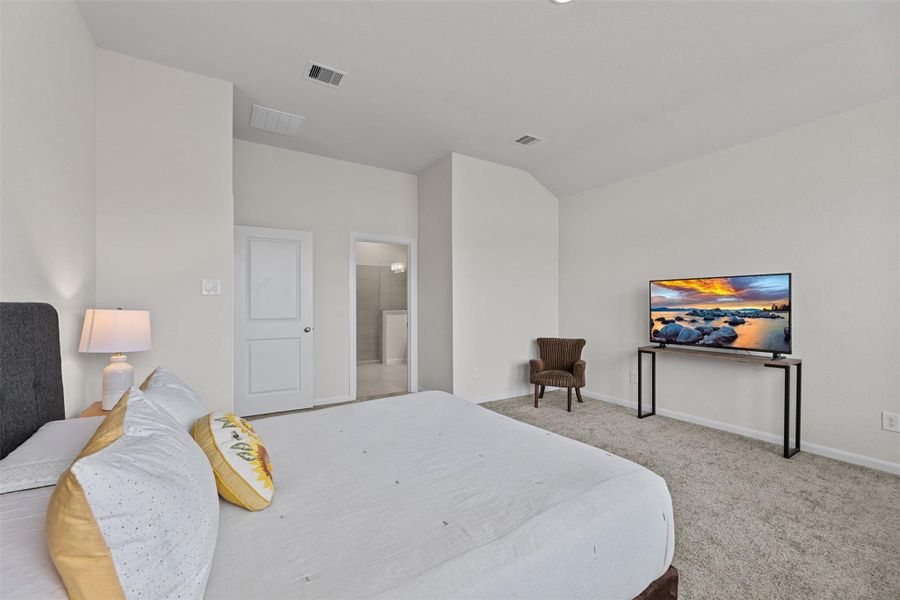 Another view of the primary bedroom shows the spaciousness and peeks into the bathroom retreat. Another view of the primary bedroom shows the spaciousness and peeks into the bathroom retreat.