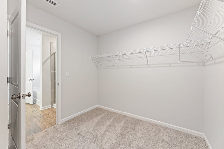 A room with a white wall and a metal railing. A room with a white wall and a metal railing.