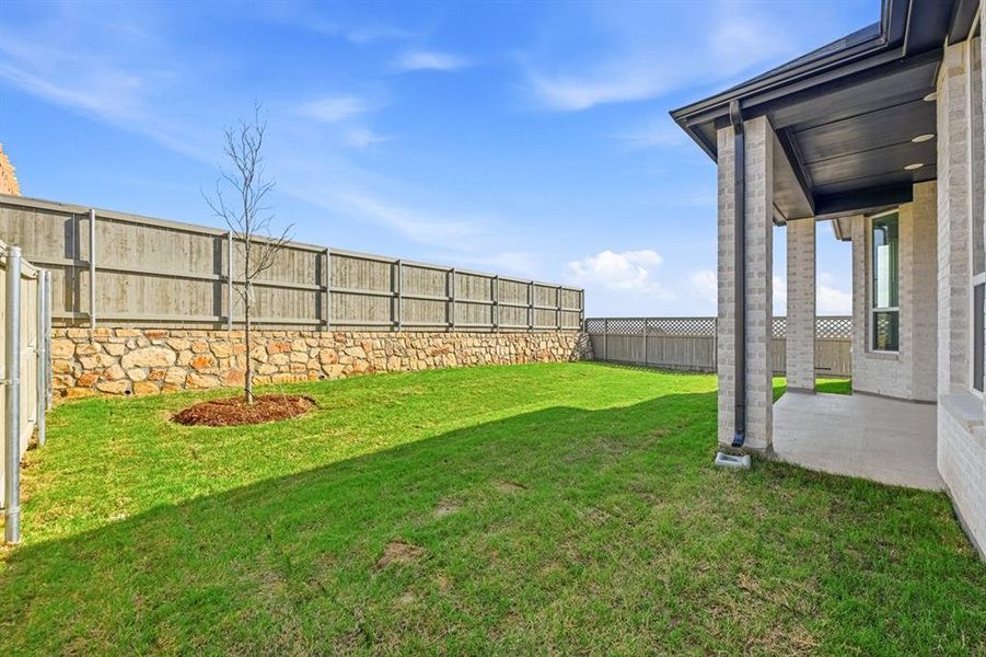 Exterior details and patio area of a home in Pecan Square, Northlake (Image 3).