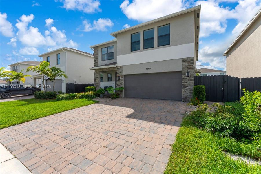 Front exterior of a new home in , Homestead, FL, highlighting curb appeal (Image 22).