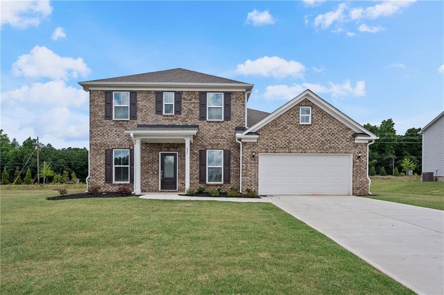 Front exterior of a new home in Anderson Point Estates, McDonough, GA, highlighting curb appeal (Image 1).
