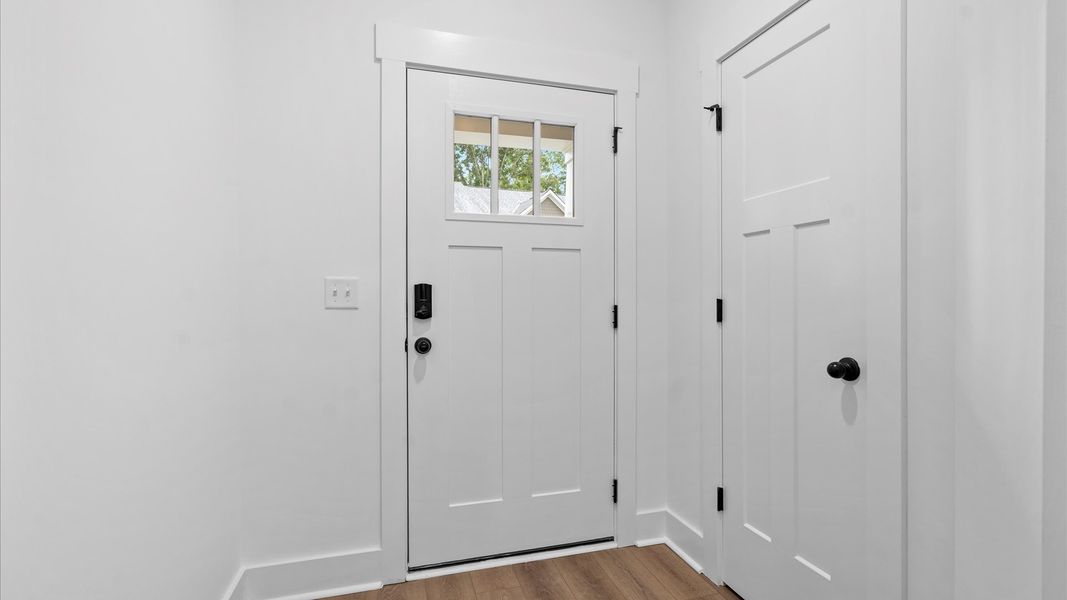 Accomplished hardwood foyer offering tasteful detail and a welcoming presence Accomplished hardwood foyer offering tasteful detail and a welcoming presence