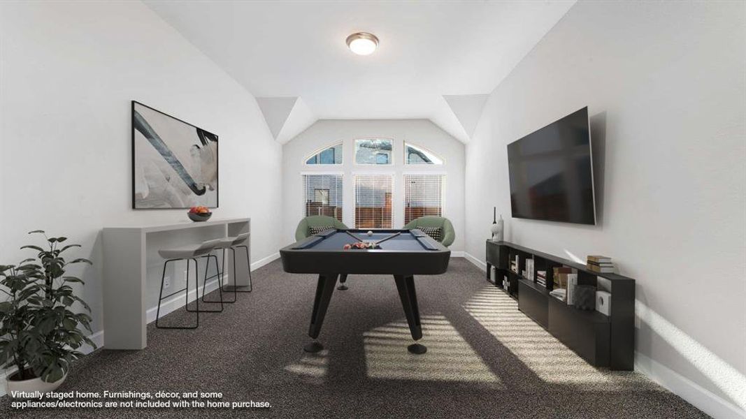 Playroom featuring pool table, vaulted ceiling, and dark colored carpet