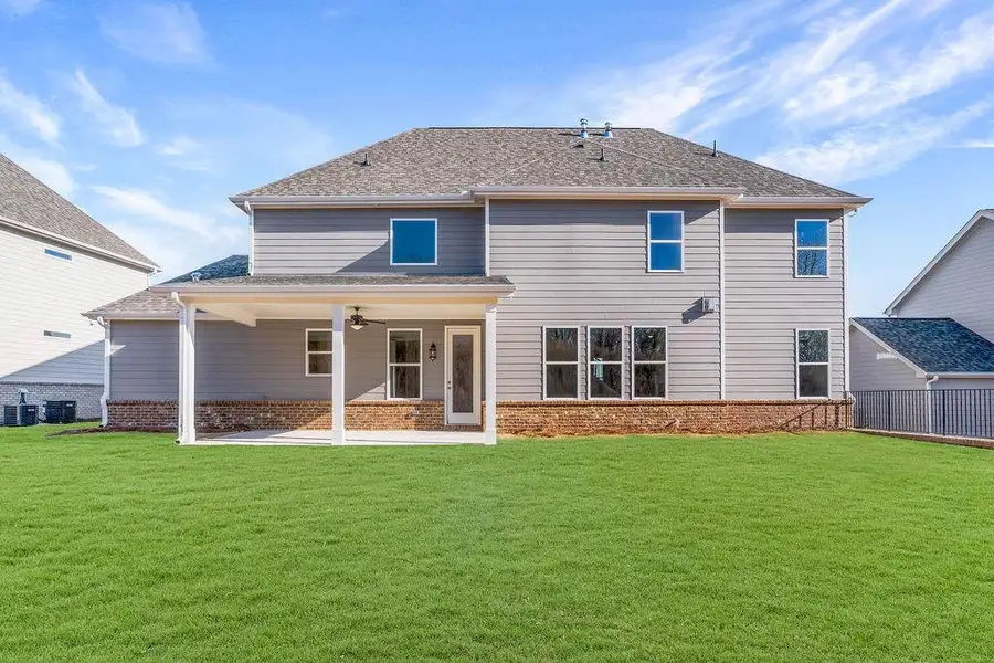 Exterior details and patio area of a home in The Manor at Gainesville Township, Gainesville (Image 3).
