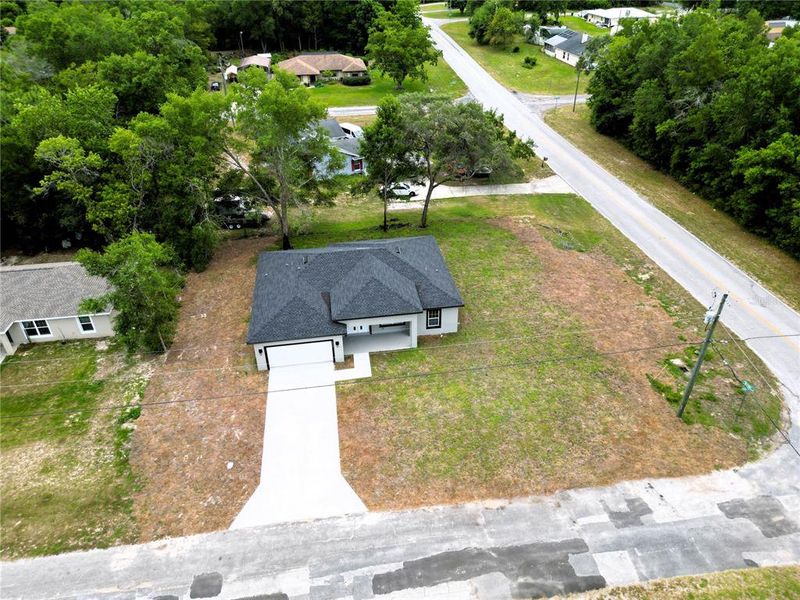 Front exterior of a new home in , Citrus Springs, FL, highlighting curb appeal (Image 9).