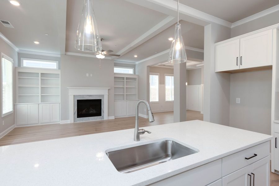 The spacious kitchen opens into the family room for easy entertaining