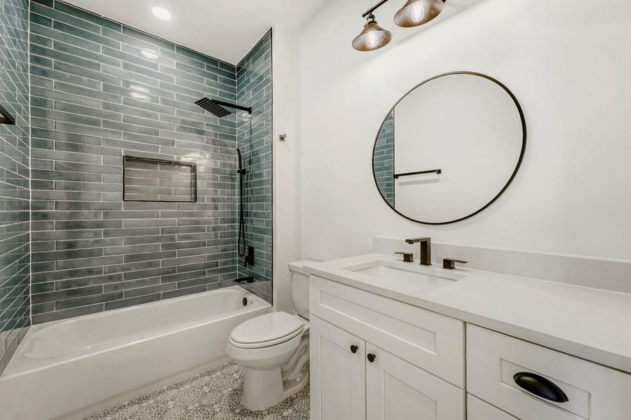 Full bath featuring vanity, bathing tub / shower combination, and recessed lighting