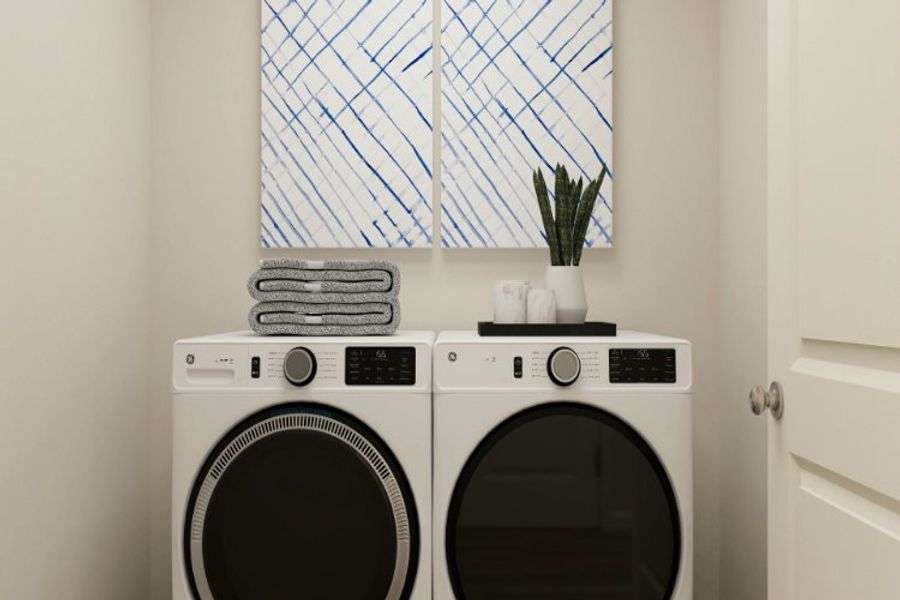 A washing machine in a room. A washing machine in a room.