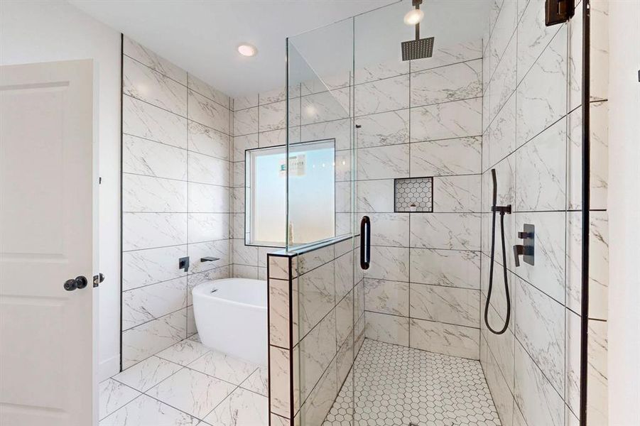 Bathroom featuring separate shower and tub