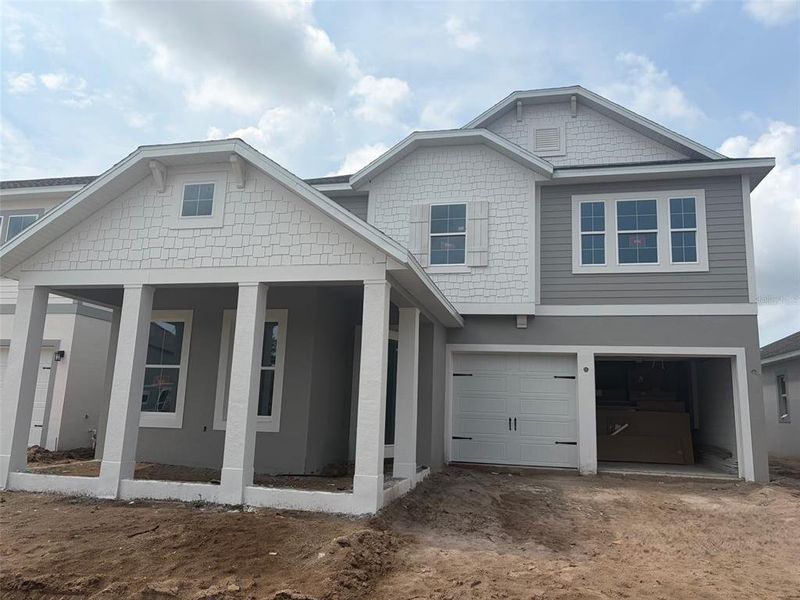 In-progress construction of a new home in Northlake at Ovation, Winter Garden, FL (Image 58).
