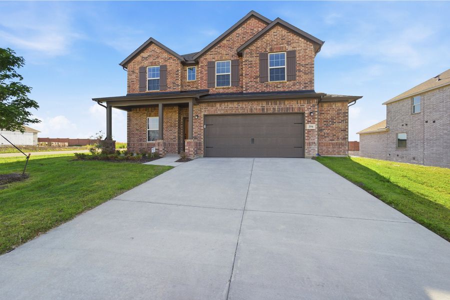 Front exterior of a new home in Saddlebrook Estates, Waxahachie, TX, highlighting curb appeal (Image 2).
