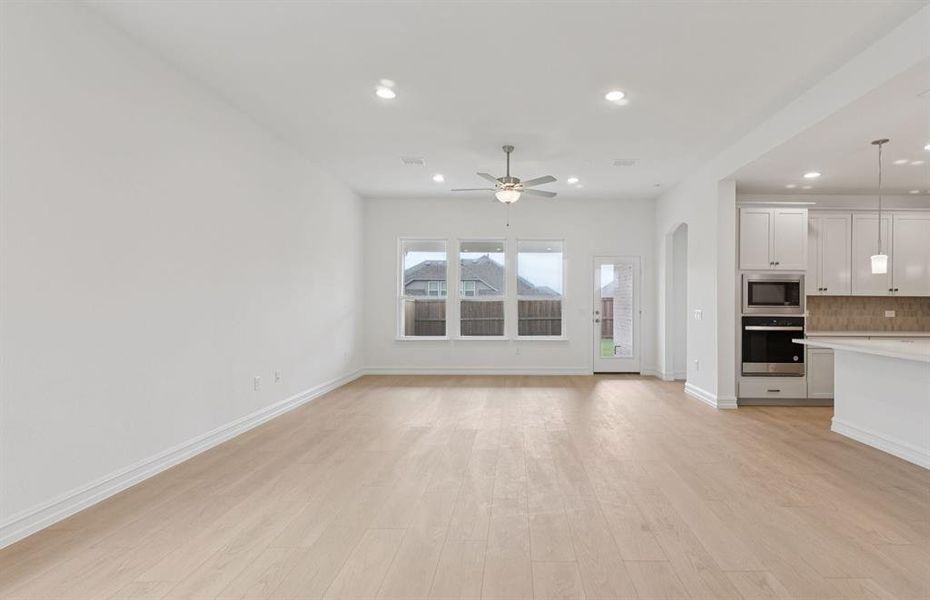 Bright kitchen with an expansive center island perfect for gatherings  *Real home pictured