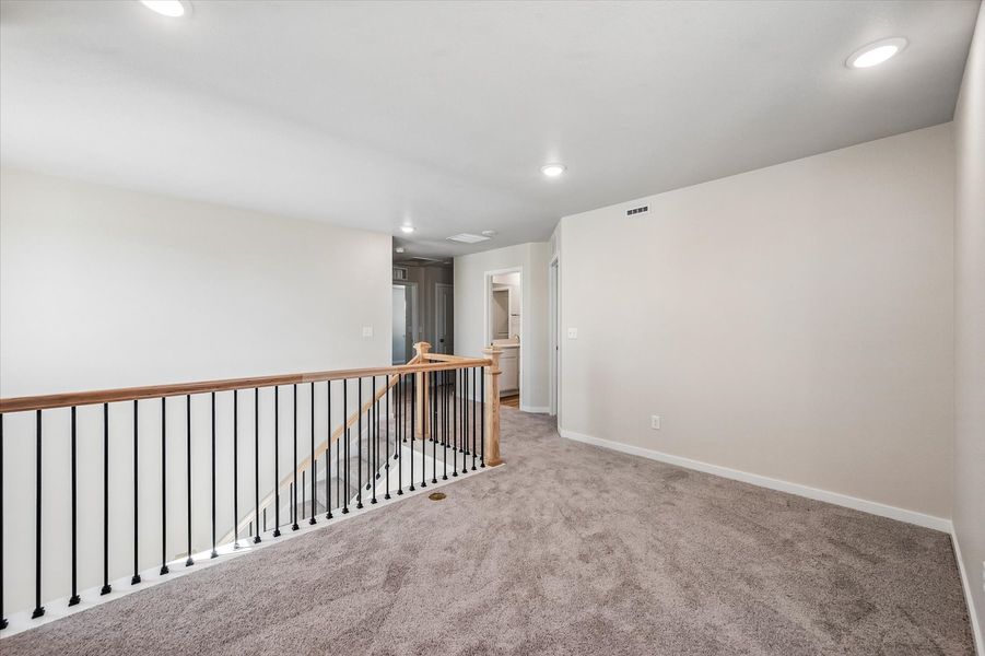 A hallway with white walls.