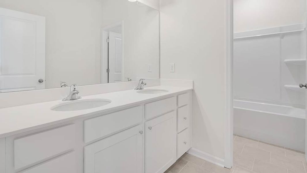 Representative furnished interior of a home built from the Ingram by Taylor Morrison in Falls Creek, Flowery Branch (Image 24).