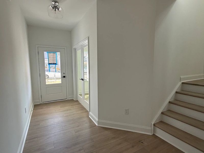 Foyer featuring the AW Collection® Coastal - Light floors and airy tones set a relaxed tone. Foyer featuring the AW Collection® Coastal - Light floors and airy tones set a relaxed tone.