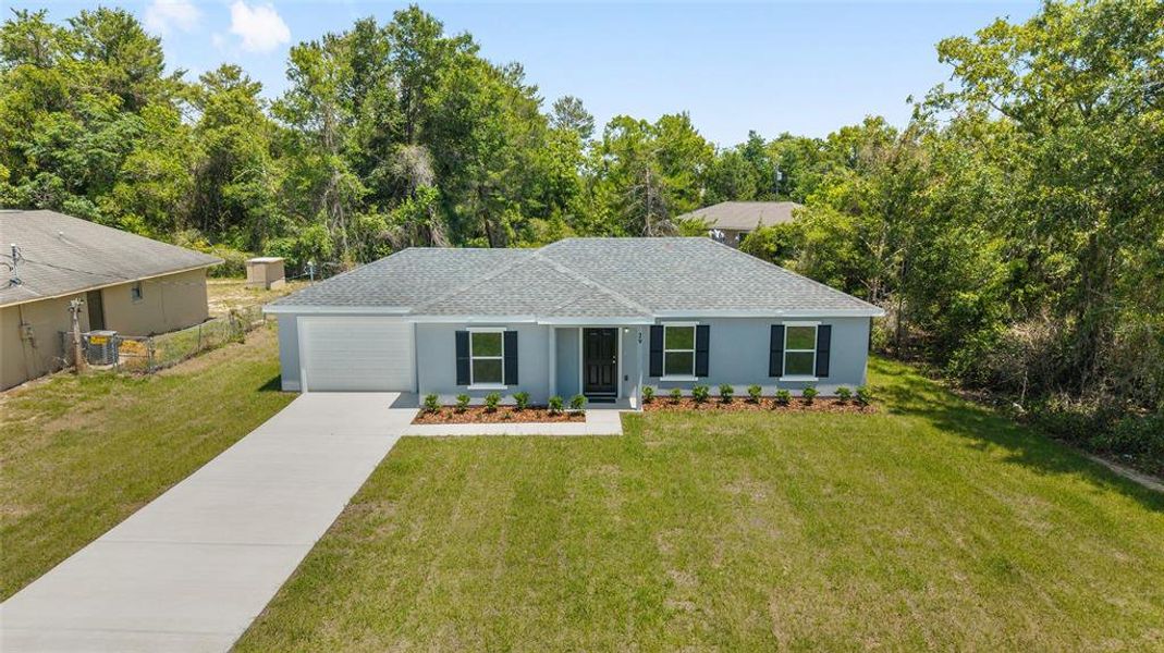 Front exterior of a new home in , Ocala, FL, highlighting curb appeal (Image 17).