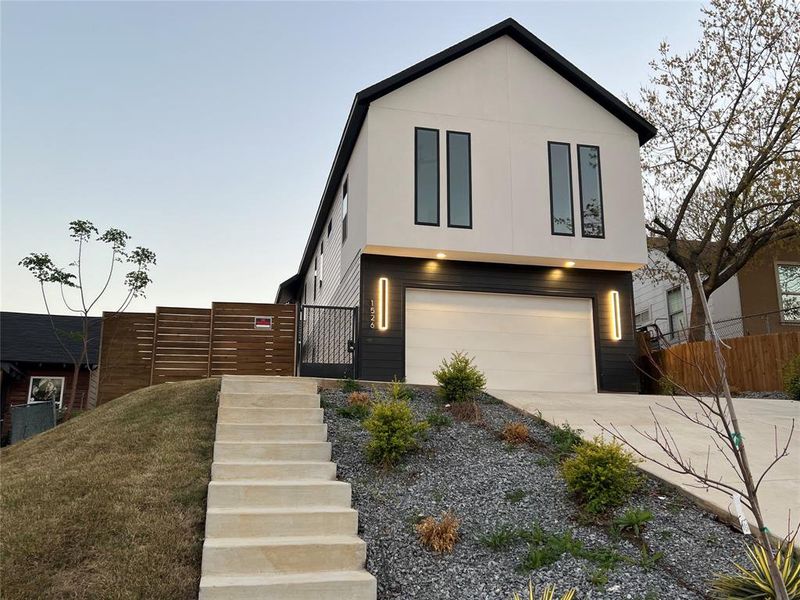 Front exterior of a new home in , Dallas, TX, highlighting curb appeal (Image 14).