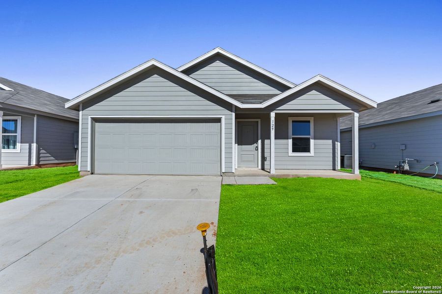 Front exterior of a new home in Friendship Oaks, Fredericksburg, TX, highlighting curb appeal (Image 1). Front exterior of a new home in Friendship Oaks, Fredericksburg, TX, highlighting curb appeal (Image 1).