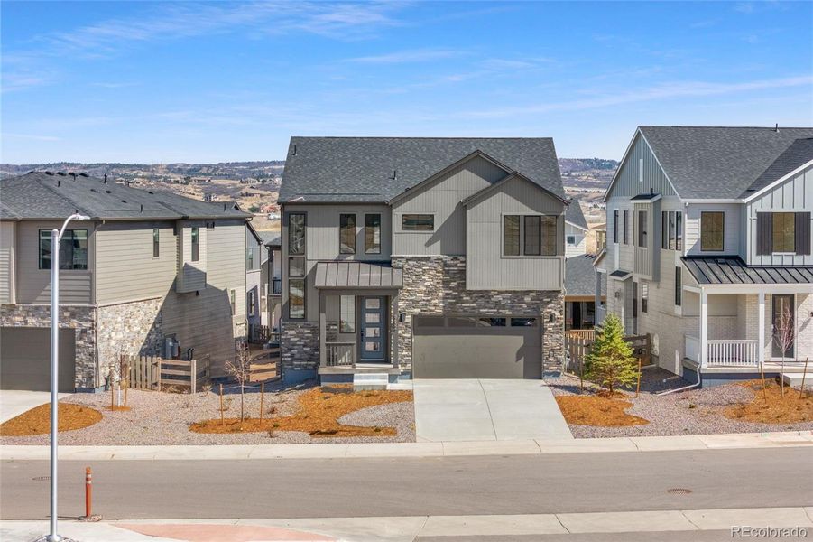 Front exterior of a new home in , Littleton, CO, highlighting curb appeal (Image 26).
