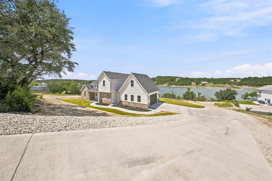 Front exterior of a new home in , Bluff Dale, TX, highlighting curb appeal (Image 2). Front exterior of a new home in , Bluff Dale, TX, highlighting curb appeal (Image 2).