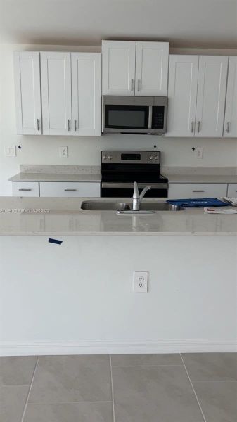 Furnished interior view inside a new home in , Lehigh Acres (Image 11).