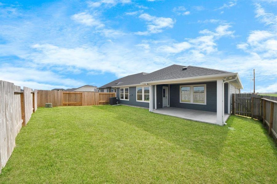 Exterior details and patio area of a home in Sweetgrass Village, Crosby (Image 28).