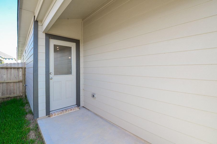 Step outside and step onto this covered porch that leads to the backyard. Step outside and step onto this covered porch that leads to the backyard.