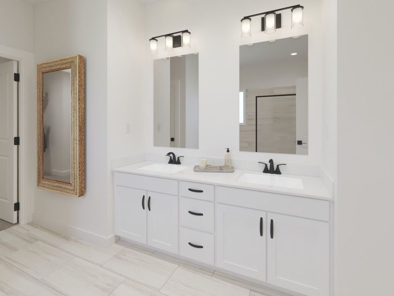 The primary bathroom offers dual vanity sinks and a walk-in shower. The primary bathroom offers dual vanity sinks and a walk-in shower.