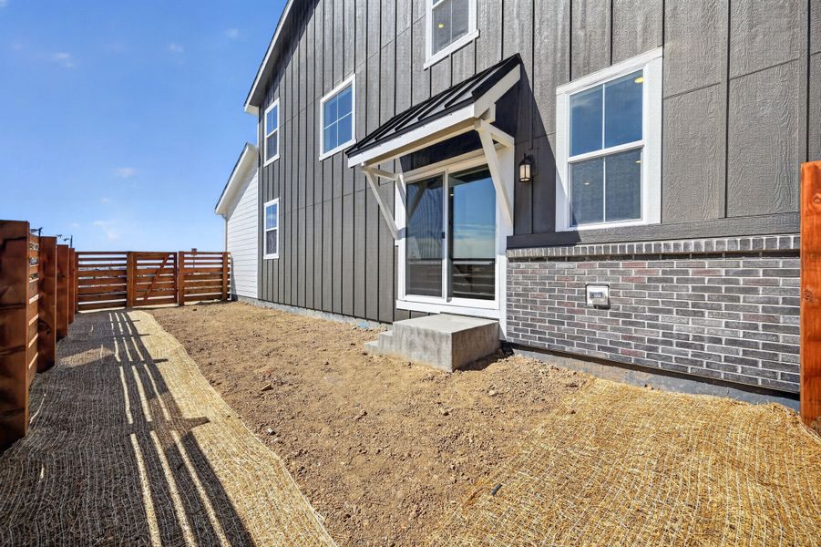 Exterior details and patio area of a home in The Aurora Highlands, Aurora (Image 3).