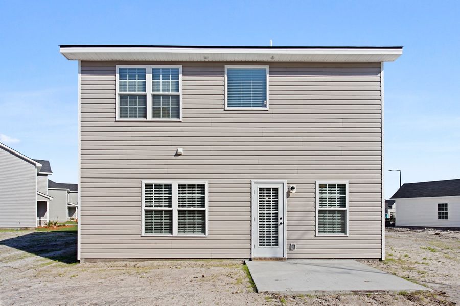 Representative exterior photo of a completed home built from the The Stacy by RTS Homes in Grand Reserve, Hinesville, GA (Image 24).